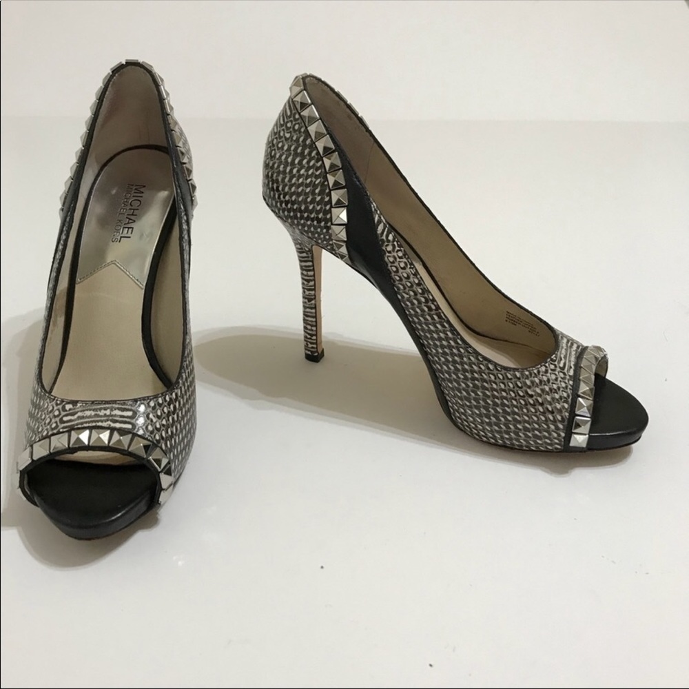 Michael Koran’s snakeskin print heels with studs.